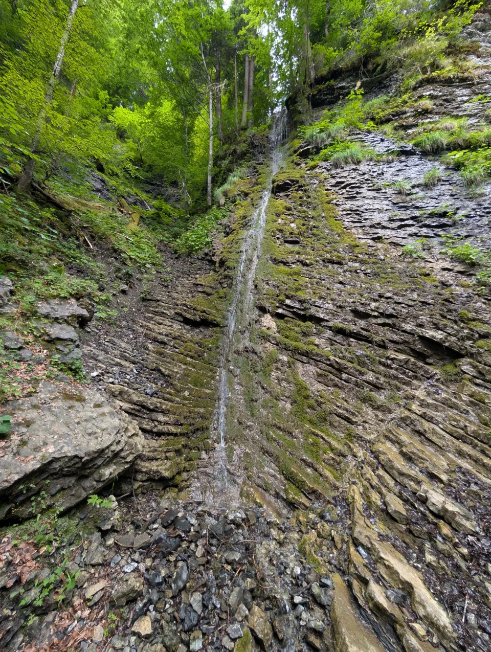 A narrow waterfall through a cleft in the rock