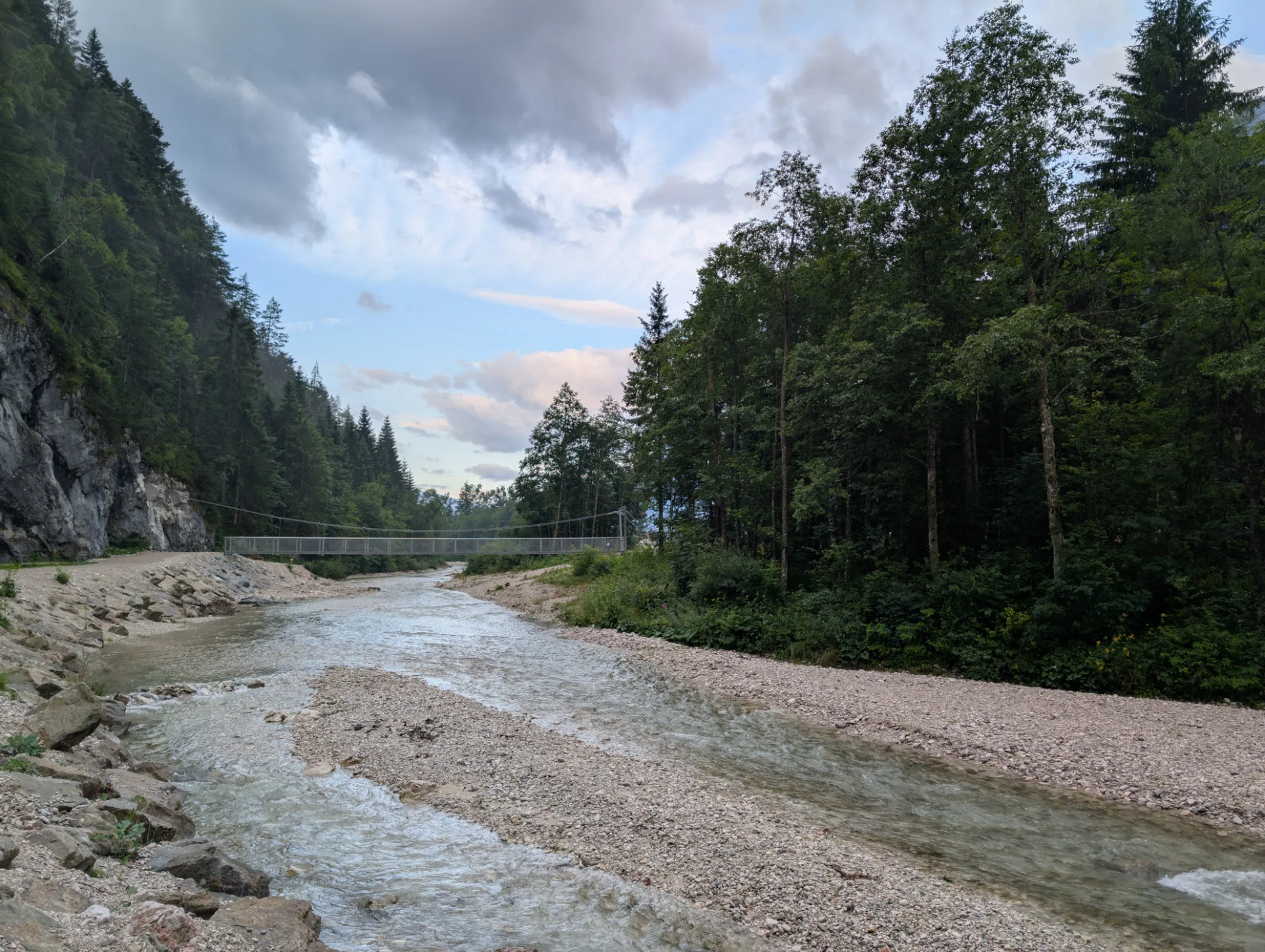 Suspension bridge over the mountain stream