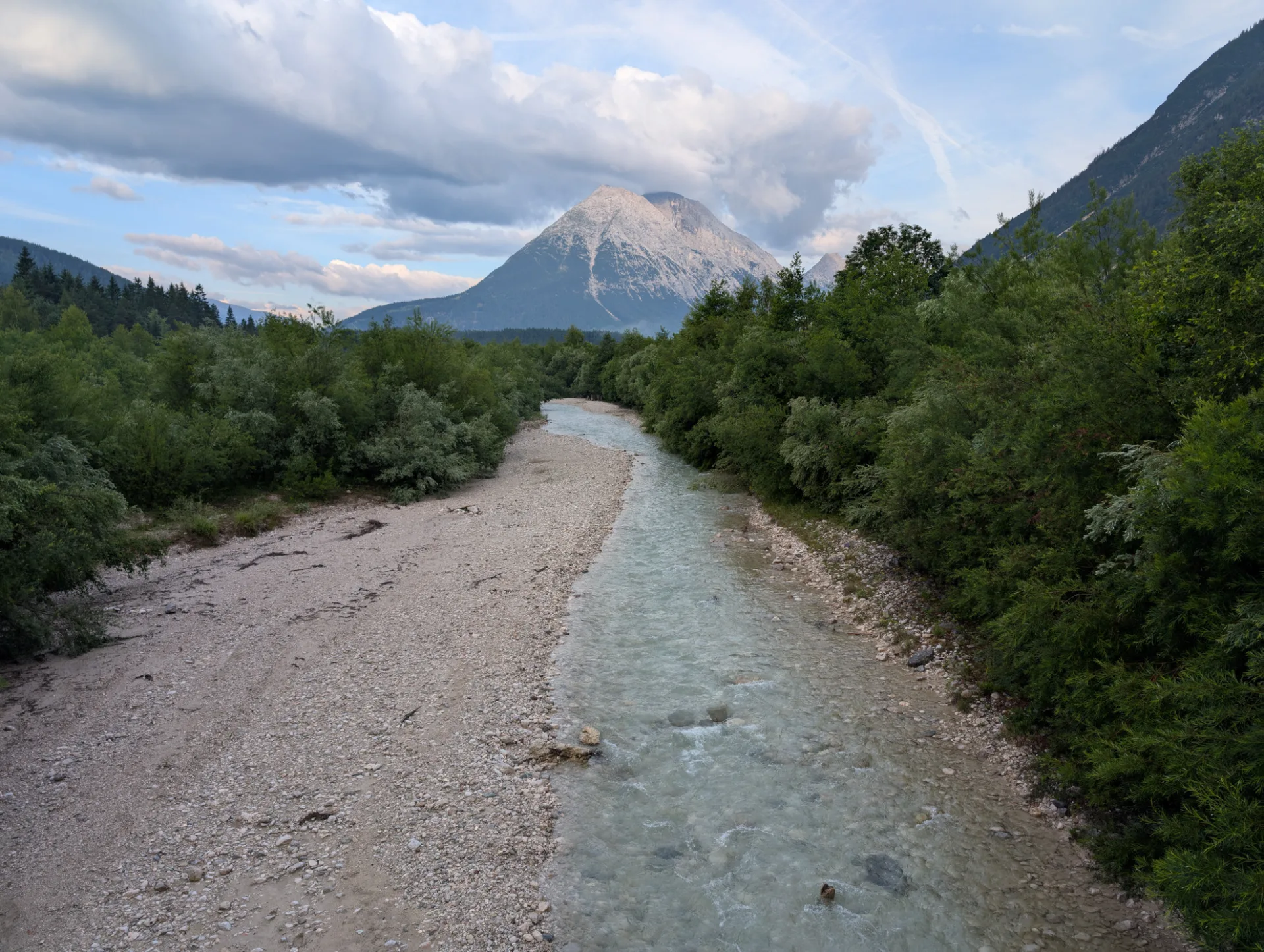 Mountain stream with the Hohe Munde in early-morning light