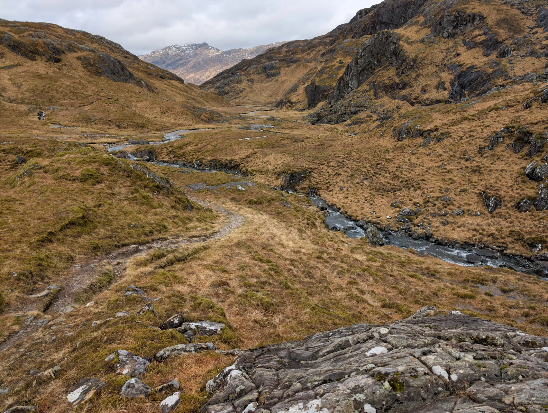 Valley with the burn running over slabs of rock
