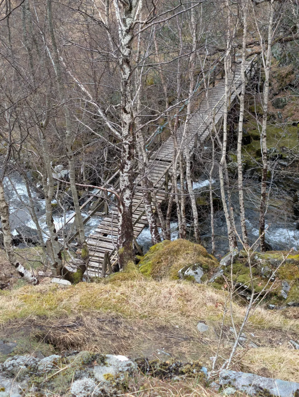 The rickety wooden bridge before Sourlies — a chunk missing from the load-bearing beam
