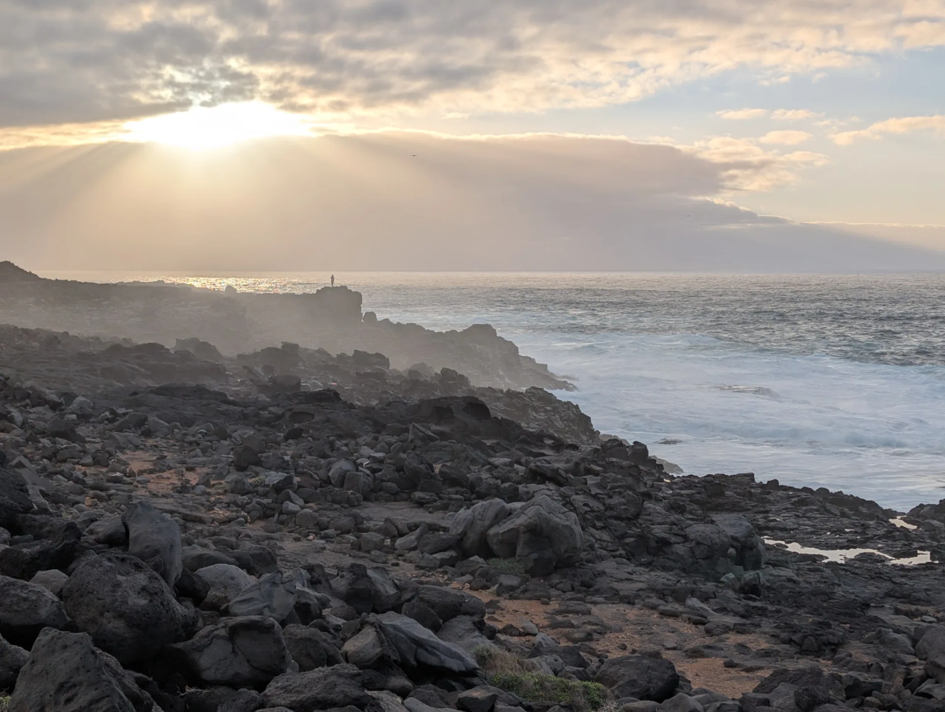 Sunset over the rocky shore of Los Charcones.