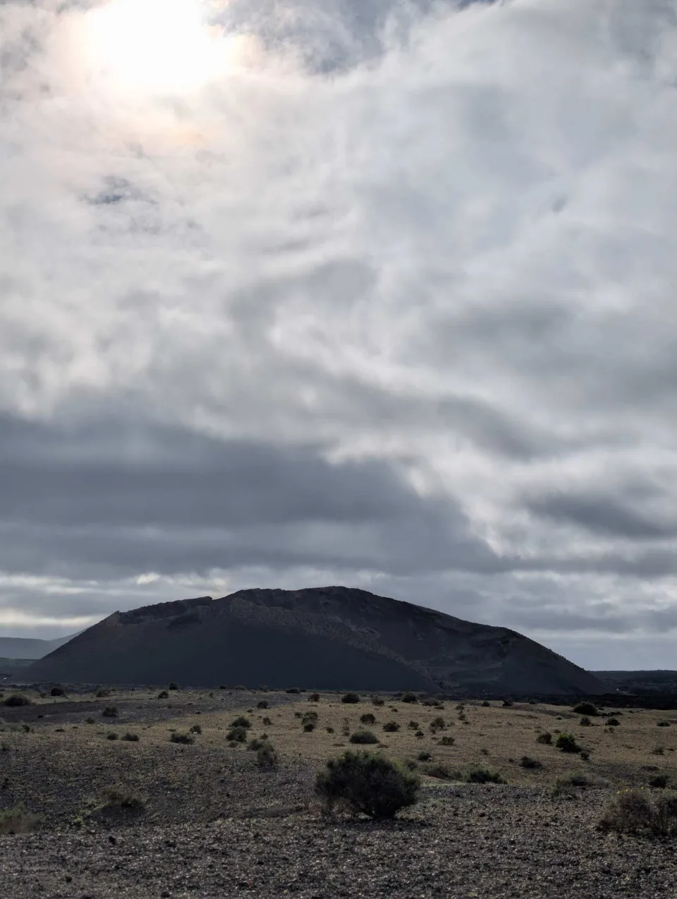 Towards the Caldera del Cuervo across the dark lava plain.