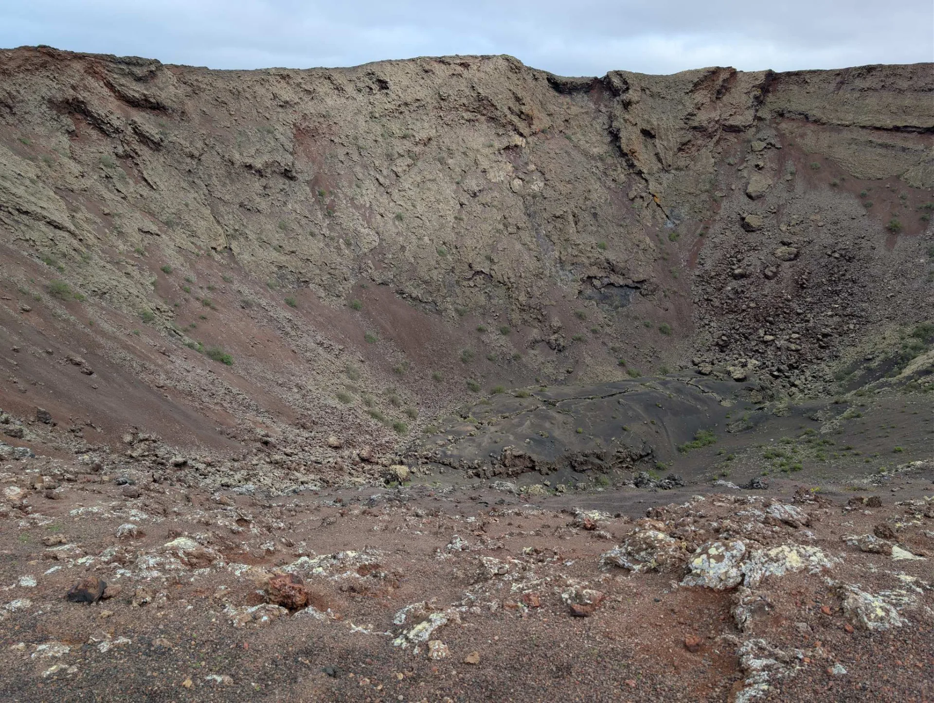 In the wide bowl of the extinct crater.