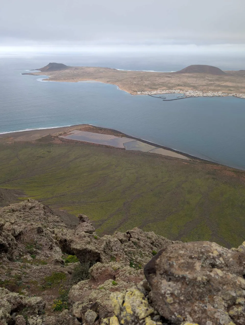 Far below, the bay at the Camino de los Gracioseros.