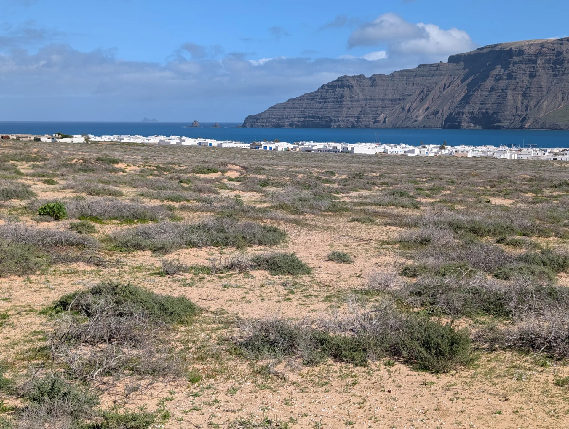 Back across the wide plain, with Lanzarote's Famara massif opposite.