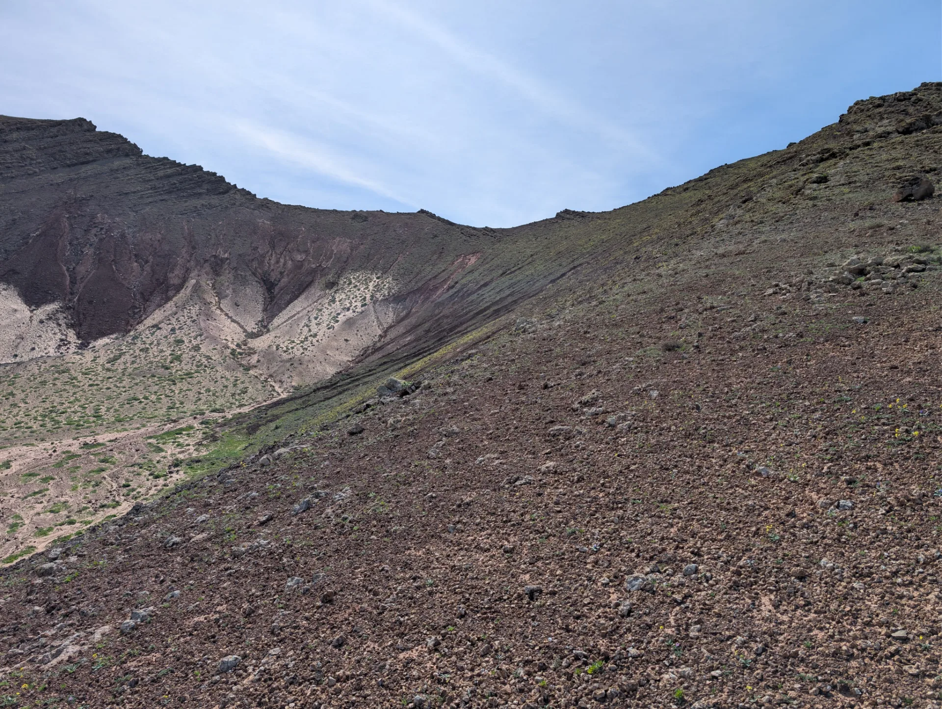 Through a volcanic valley full of winter green.