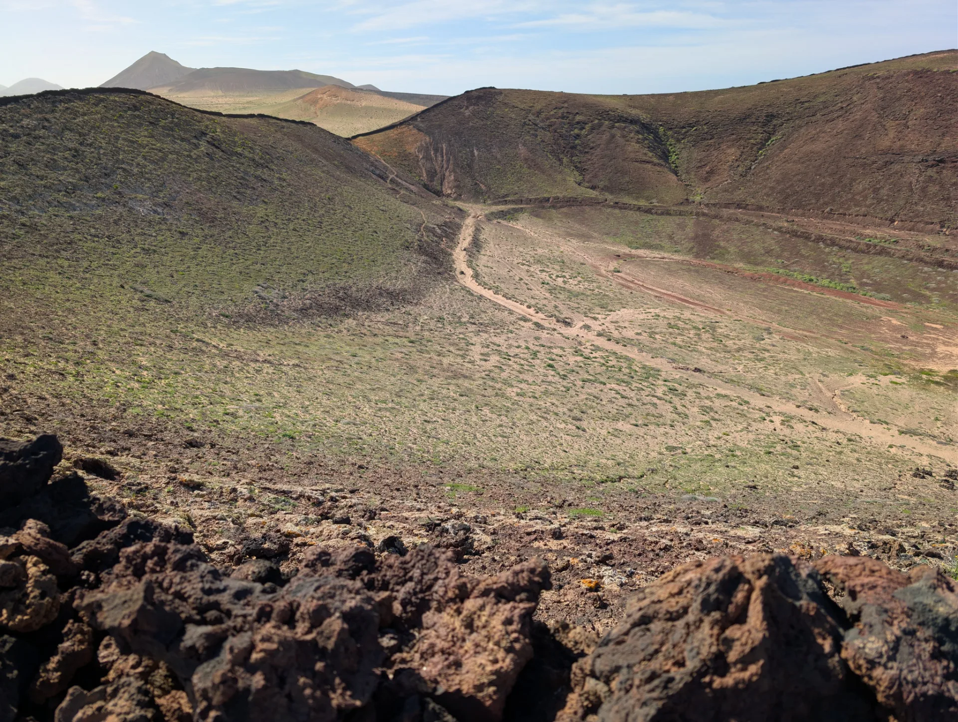 On the last walk of the trip, up over green slopes.
