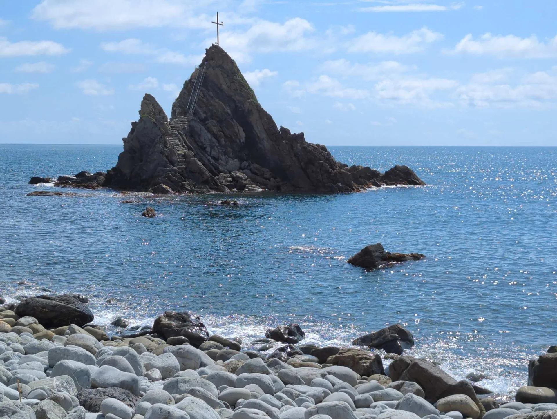 A cross-topped rock off the coast near Sestri Levante