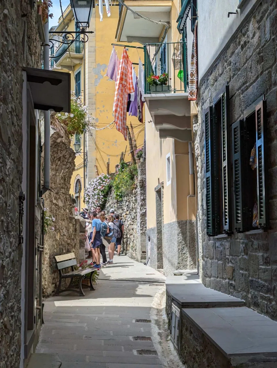 A narrow alley with washing lines in Vernazza