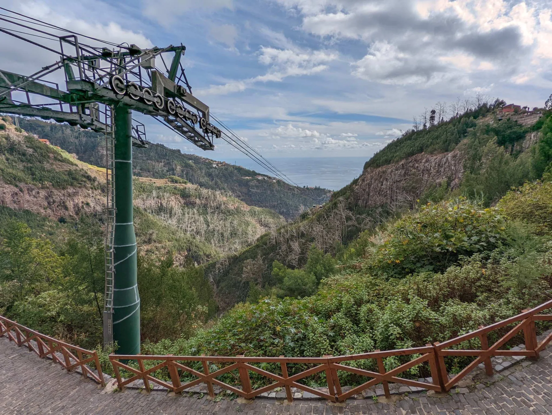 An old cable-car pylon above the valley