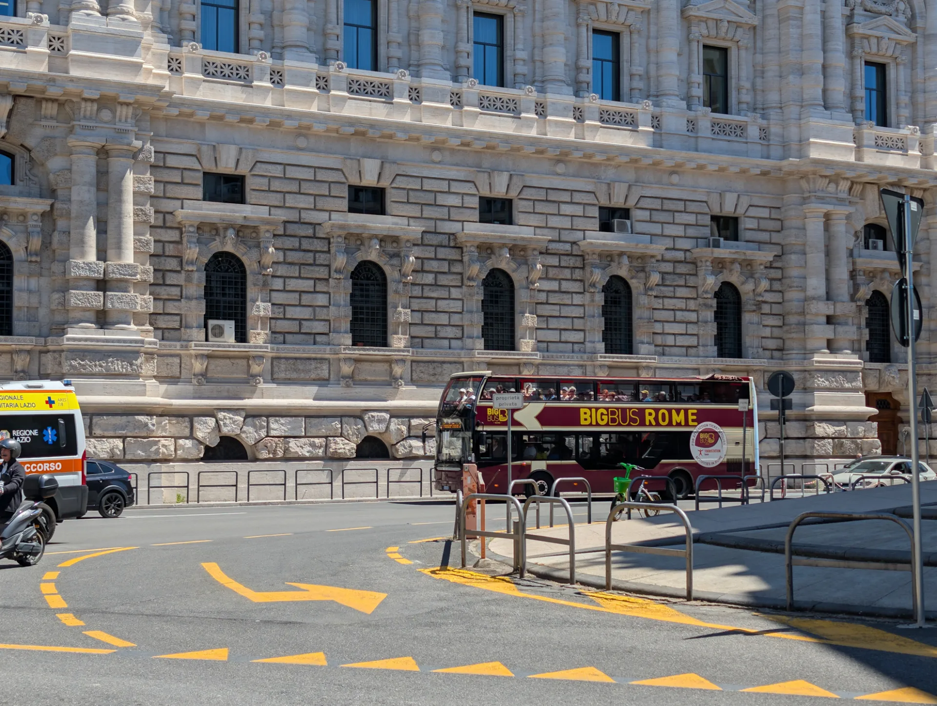 Neoclassical Palace of Justice quarter, a Big Bus Rome crossing the frame
