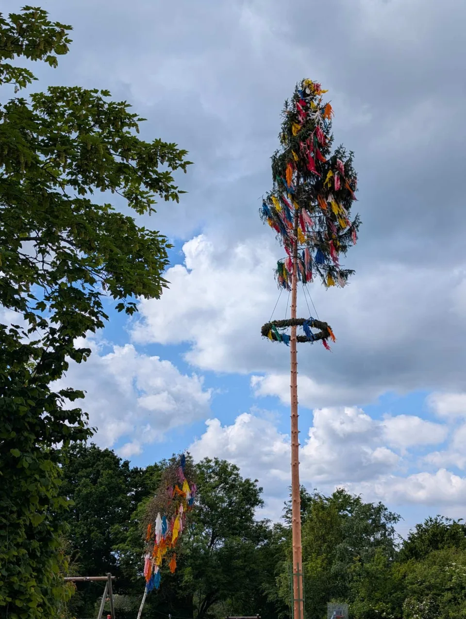 A decorated maypole in a village along the way.