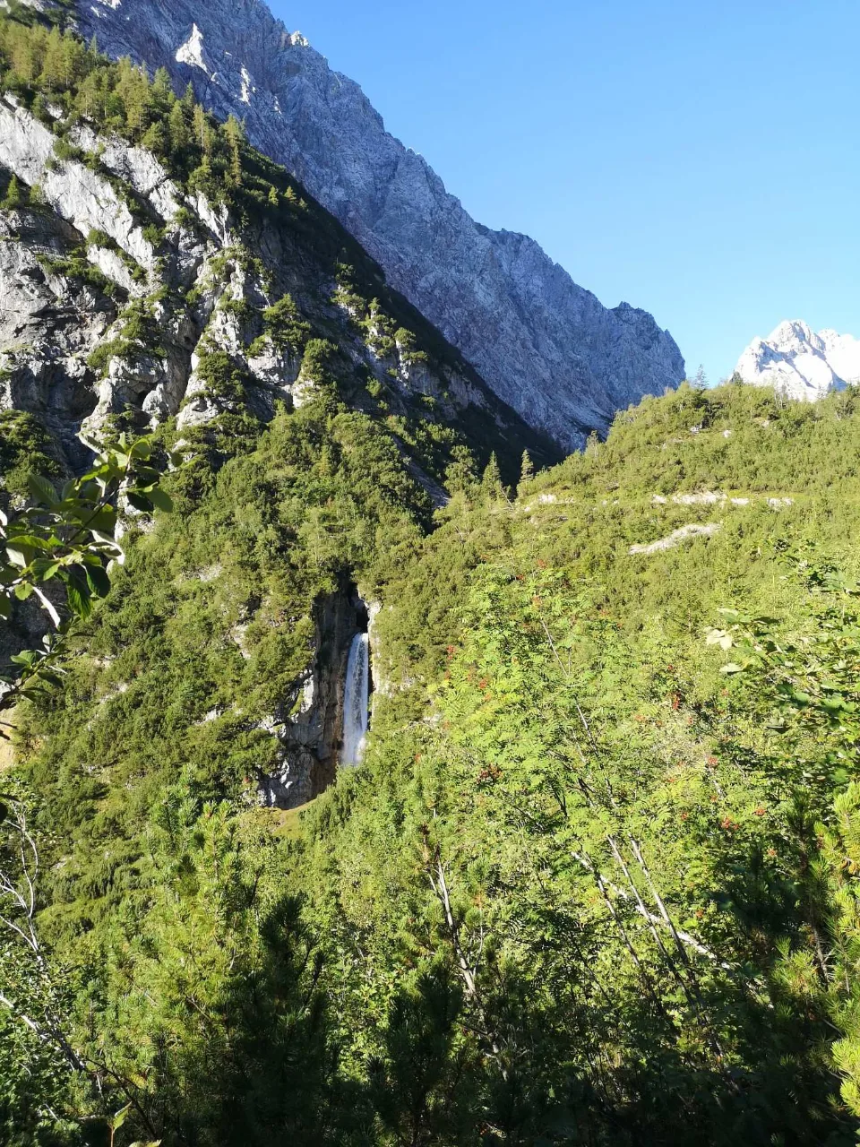 The valley opens up, the rock faces of the Zugspitze massif ahead.