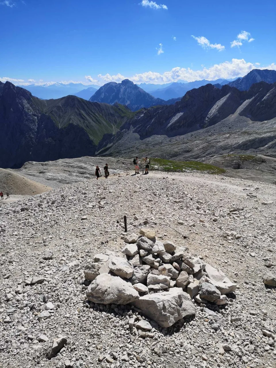 A cairn marks the way across the broad Zugspitzplatt.
